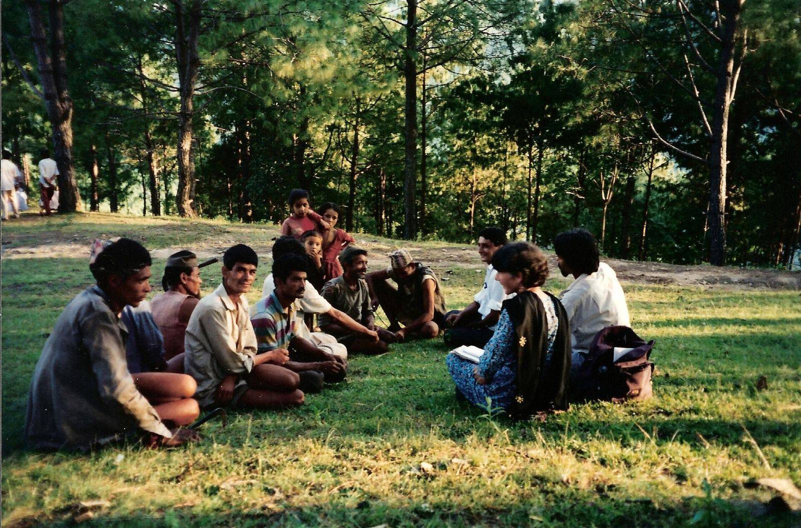 Members of a community forest user group meeting in a forest clearing in Nepal